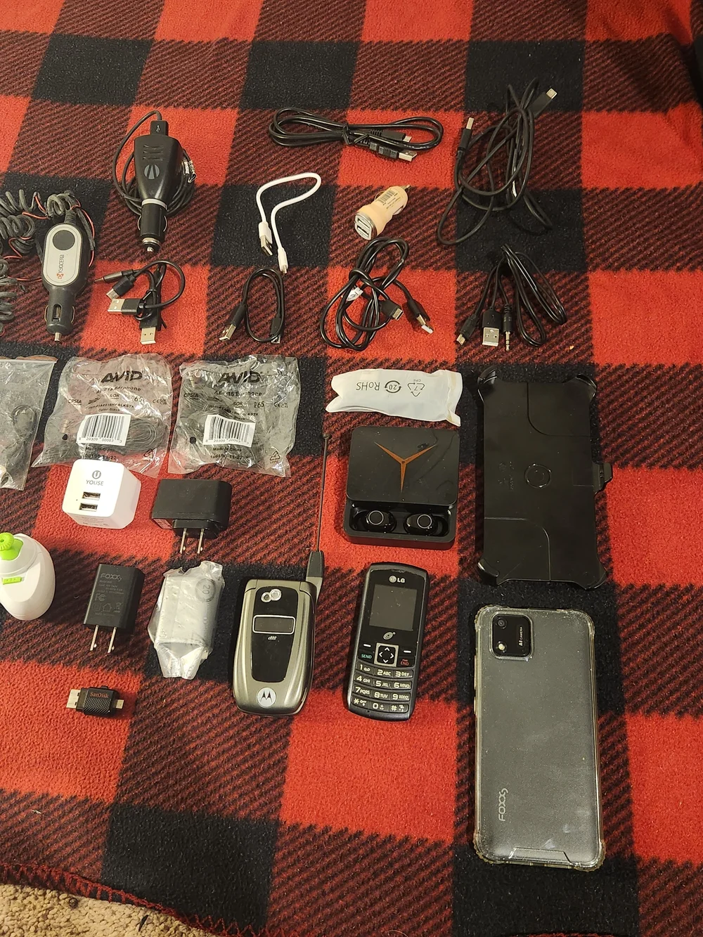 Elctronics Lot, Cellphones, Charging Cords, Remotes, And More